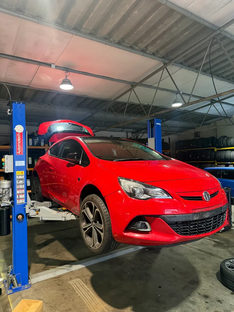Astra on a garage ramp