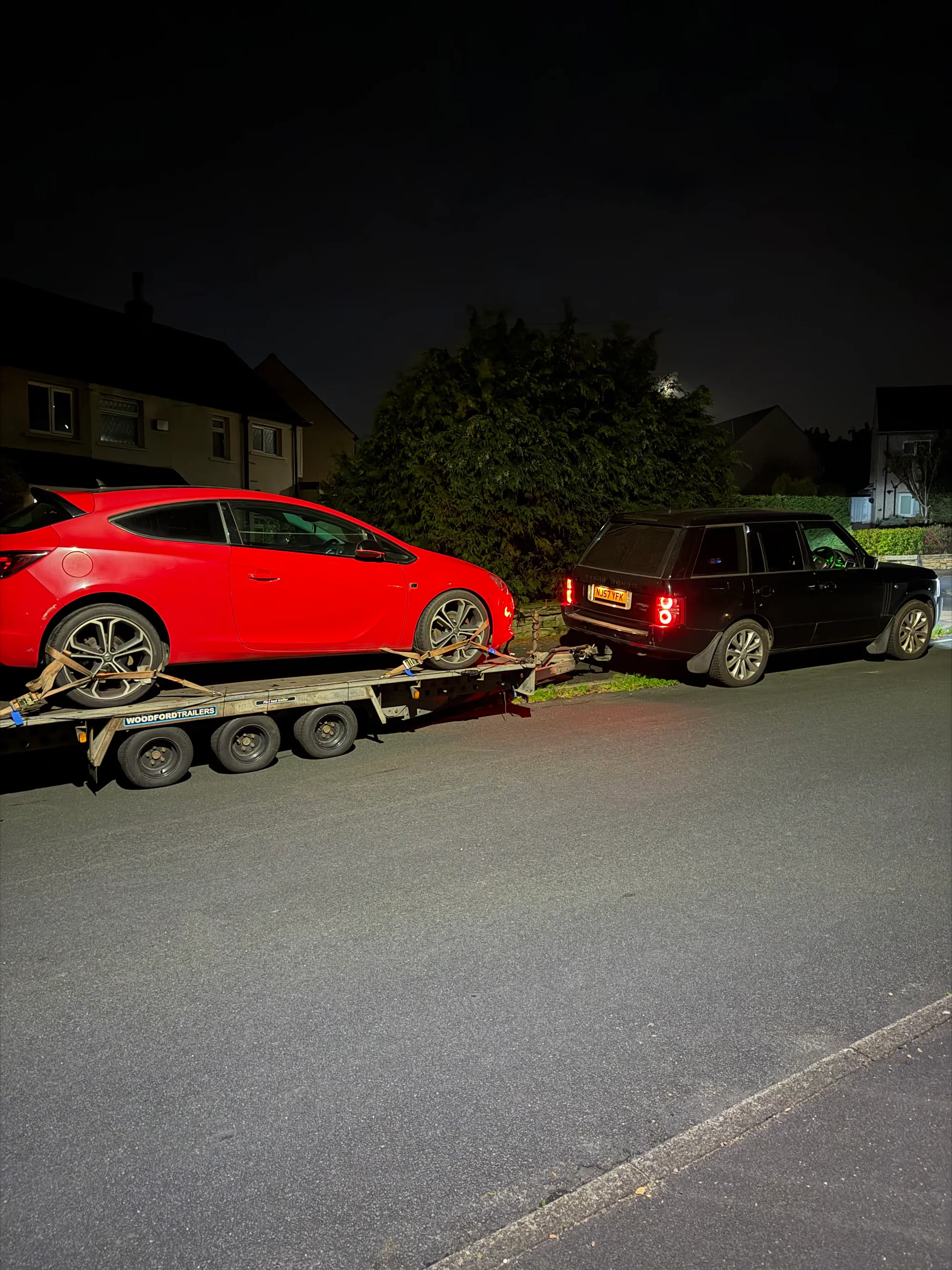 Astra towed on a flatbed recovery truck