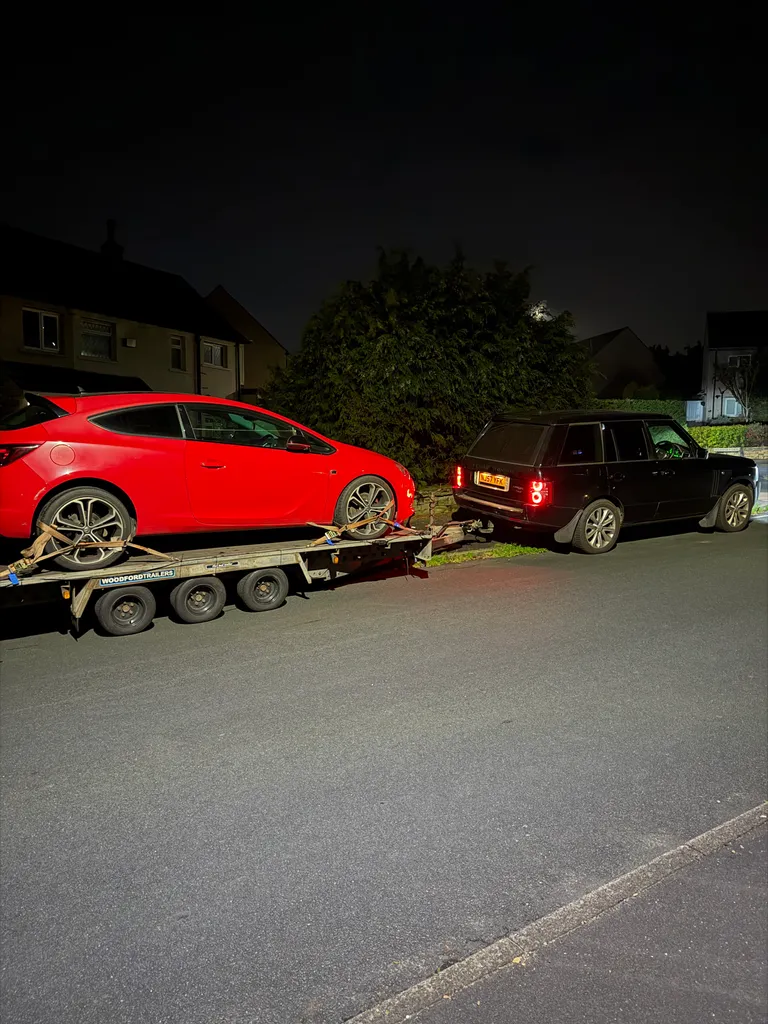 Astra towed on a flatbed recovery truck