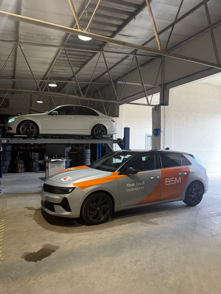 Learner vehicle on a garage ramp