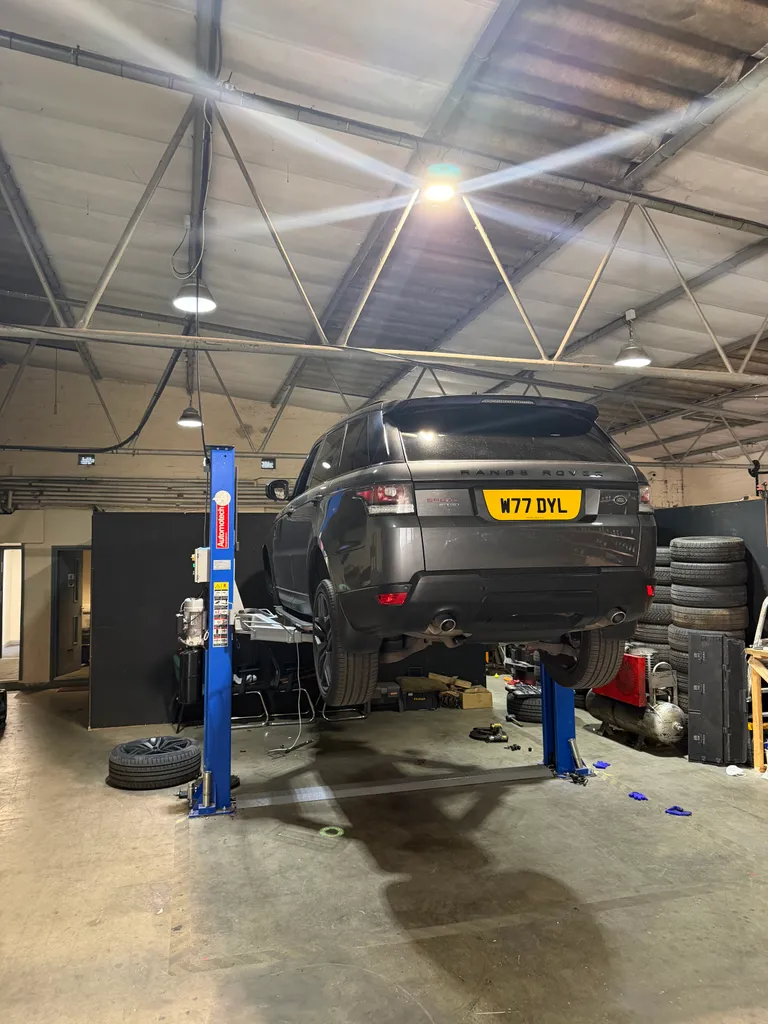 Range Rover on a garage ramp