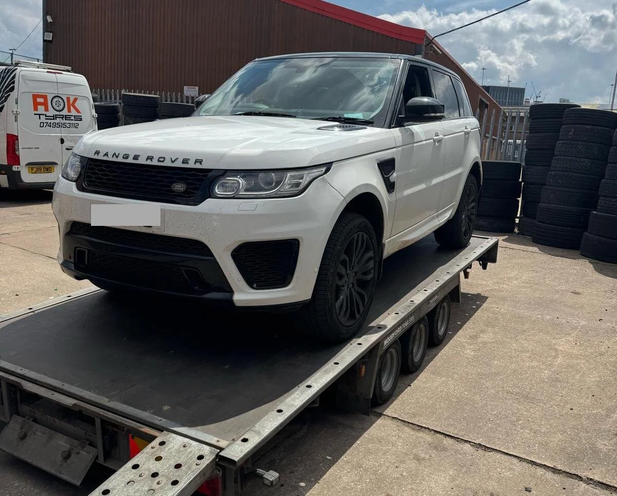 Range rover on a recovery truck bed